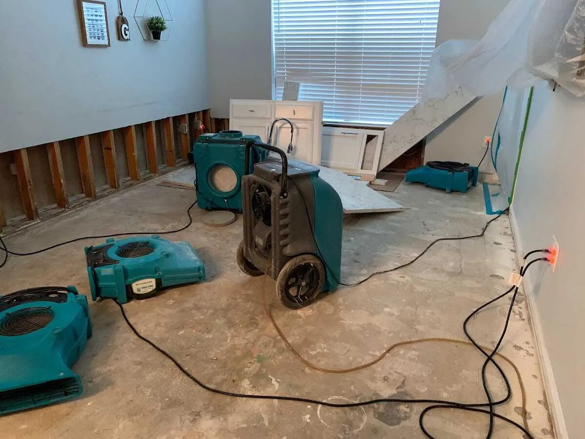 Dehumidifier in flood-cut room for Water Damage Restoration in Highlands Ranch
